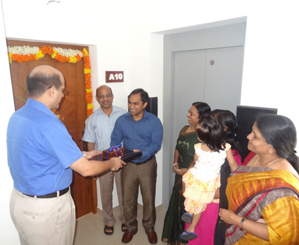 Keys being handed over to Mr. Ranjeev Rajan of apartment no A 10